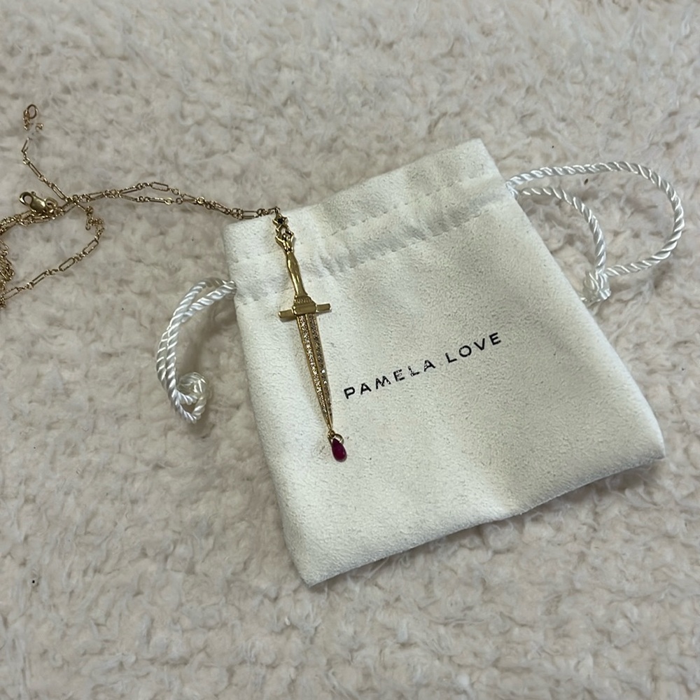 Pamela Love fine jewelry Dagger pendant with diamonds and ruby